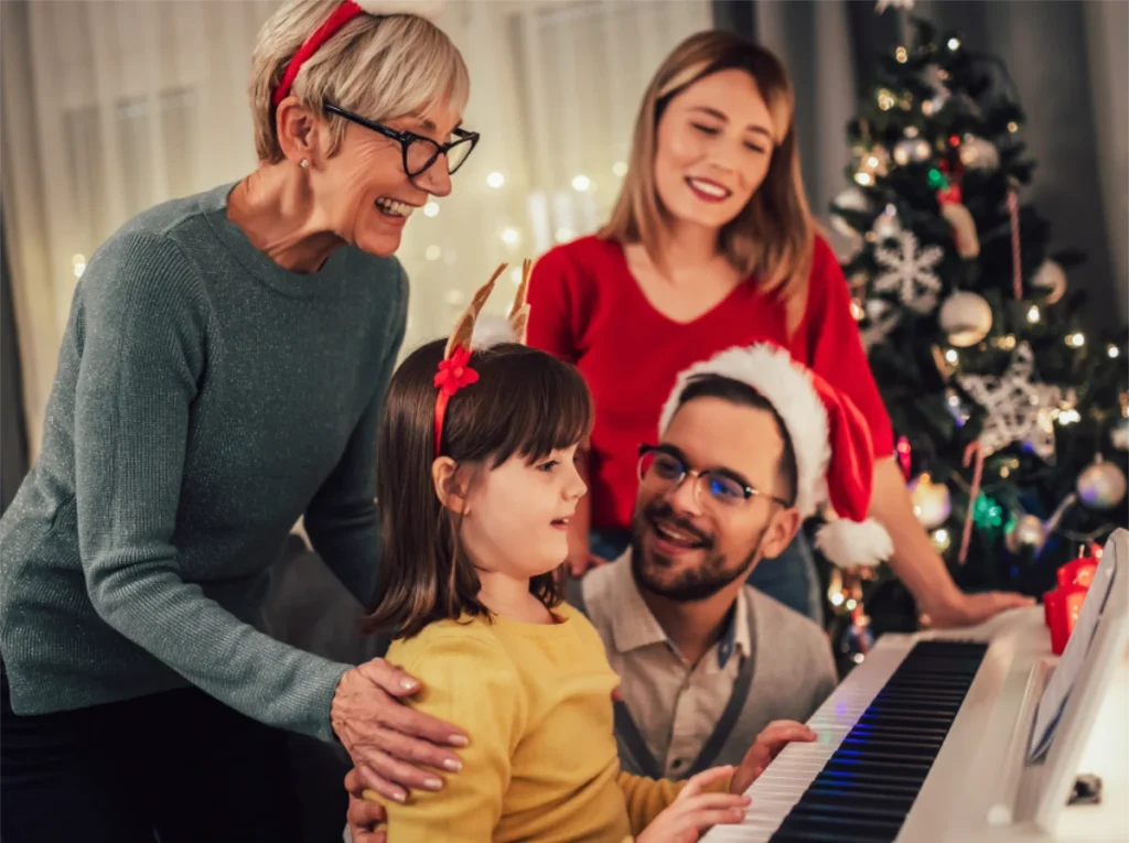The sound of the season family around piano The sound of the season family around piano