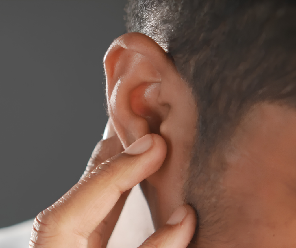 Hearing loss Man touching ear